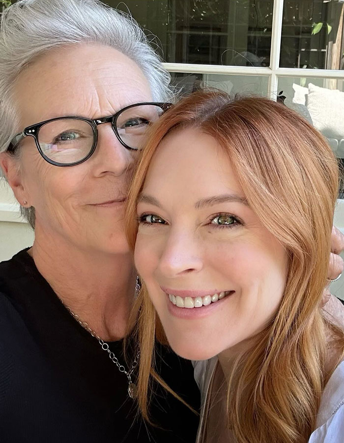 Jamie Lee Curtis smiling with a friend in a close selfie, responding to fan memes about her viral cleavage moment. Jamie Lee Curtis smiling with a friend in a close selfie, responding to fan memes about her viral cleavage moment.