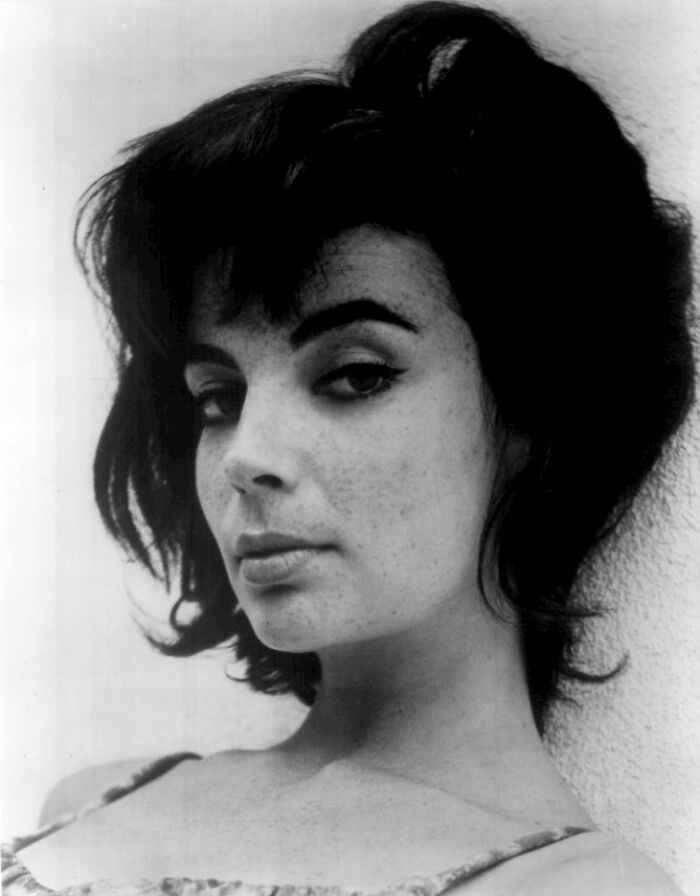 Black and white portrait of an LA woman from 1962 with dark hair and confident expression living her best life