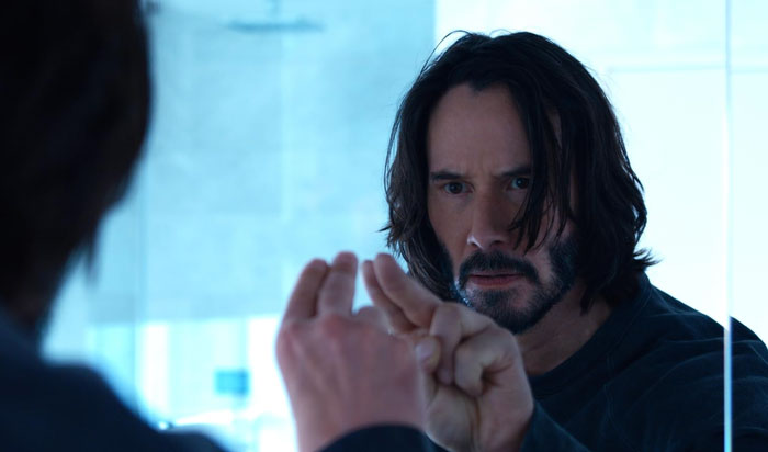 Keanu Reeves looking intently at his reflection while touching a glass, AI transformed with Jack Sparrow elements. Keanu Reeves looking intently at his reflection while touching a glass, AI transformed with Jack Sparrow elements.