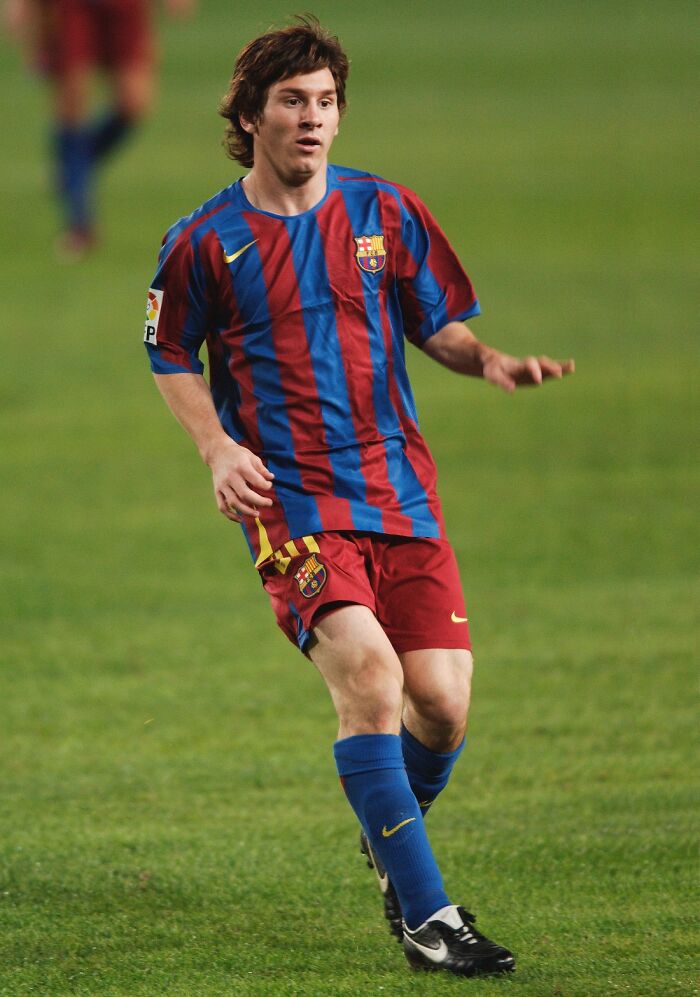 Young soccer player in a FC Barcelona uniform captured mid-action on the field, representing PR campaign failures concept.