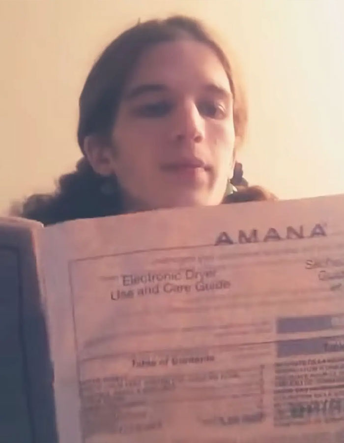 Young person holding an electronic dryer manual in a video linked to Minneapolis Catholic school suspect manifesto. Young person holding an electronic dryer manual in a video linked to Minneapolis Catholic school suspect manifesto.