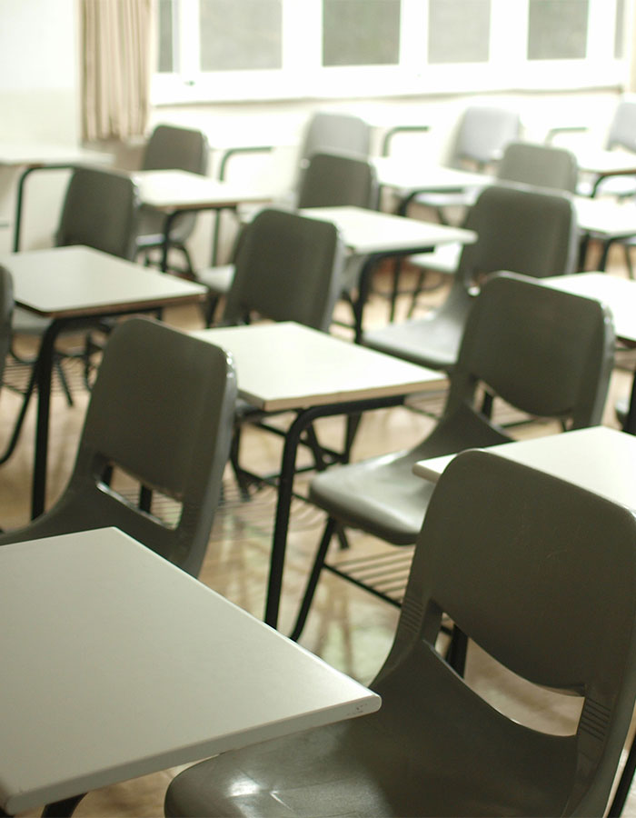 Empty classroom desks and chairs in a Minneapolis Catholic school setting reflecting a chilling suspect manifesto video. Empty classroom desks and chairs in a Minneapolis Catholic school setting reflecting a chilling suspect manifesto video.