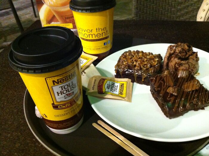 Nestle Toll House coffee cups and desserts on a tray, illustrating PR campaigns and decisions that were fails.