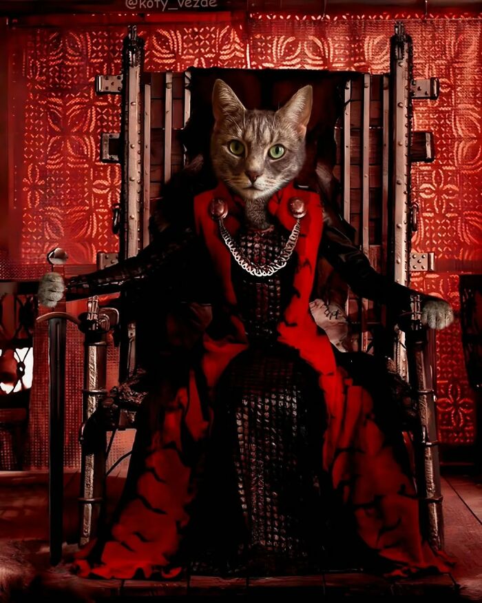 Majestic cat dressed as a historical figure seated on a throne in an elaborate red and black outfit in historical portrait style.