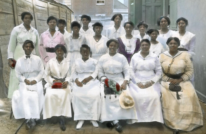 Group portrait of African American women in 1920s attire, showcasing the colorized photos revealing their reality.