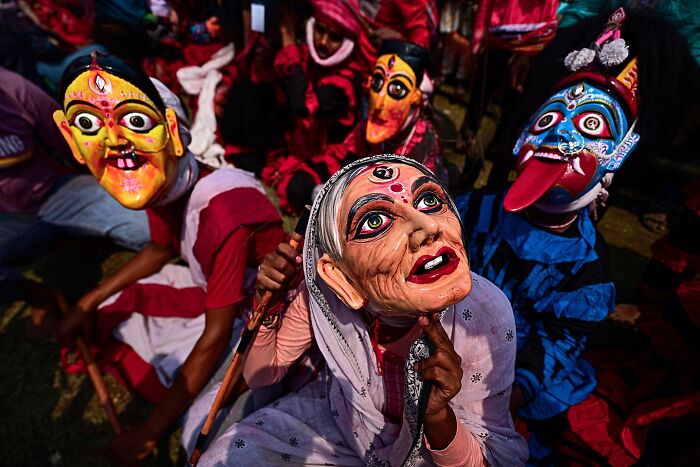 Vivid colorful masks worn by performers during a traditional cultural festival in India bursting with life and energy.