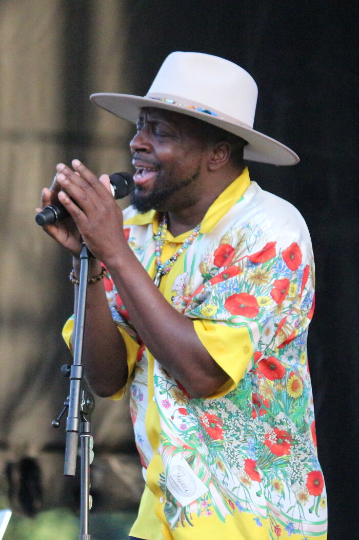 Man in a floral shirt and wide-brim hat singing into microphone, illustrating PR campaigns and decisions fails concept.