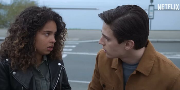 Two young adults in an intense conversation outdoors, featured in a Netflix movie from disappointing Netflix movies list.