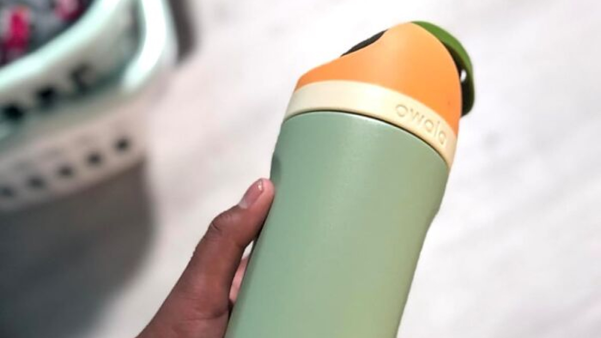 Hand holding an Owala water bottle, one of the Amazon best seller list products worth the hype.