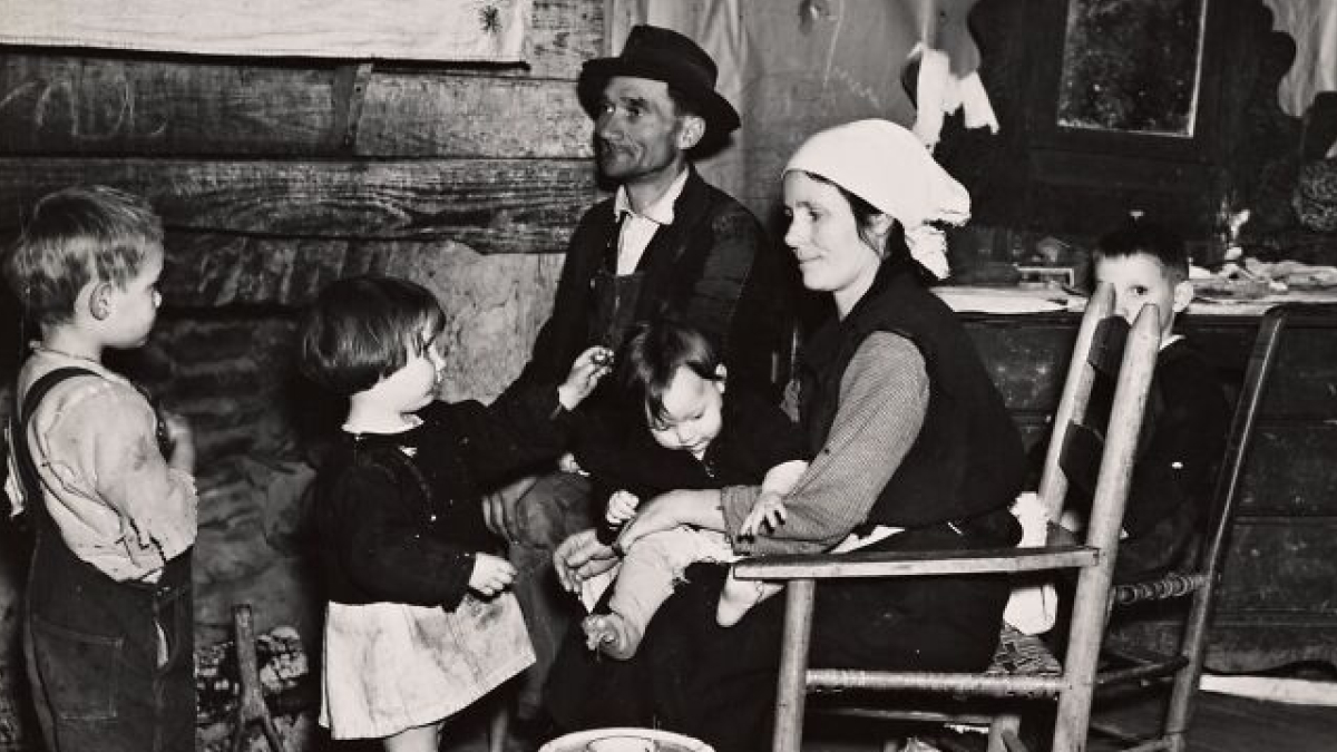Great Depression era family in a modest home, parents with children showing daily life during the economic hardship.