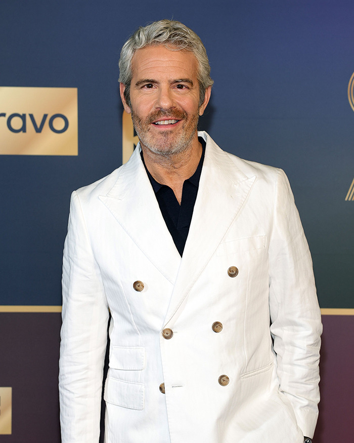 Andy Cohen wearing a white suit at a Bravo event, known for viral roast of anti-LGBTQ activist Kim Davis. Andy Cohen wearing a white suit at a Bravo event, known for viral roast of anti-LGBTQ activist Kim Davis.