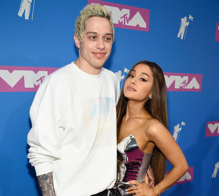 Pete Davidson and Ariana Grande posing on the red carpet at the MTV Video Music Awards event. Pete Davidson and Ariana Grande posing on the red carpet at the MTV Video Music Awards event.
