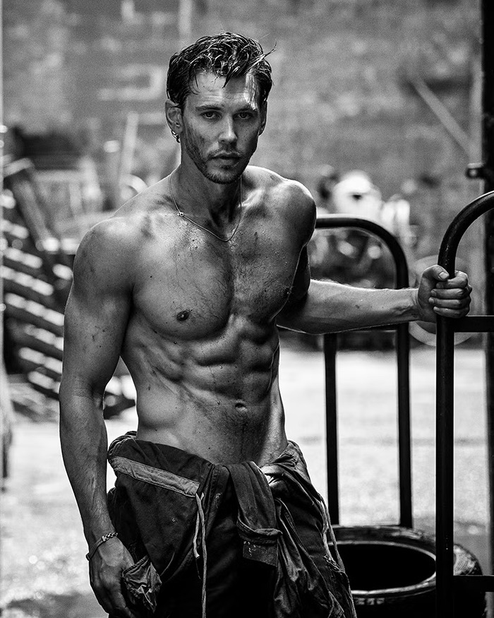Austin Butler in a shirtless photoshoot showcasing peak male body and muscular physique in a gritty urban setting. Austin Butler in a shirtless photoshoot showcasing peak male body and muscular physique in a gritty urban setting.