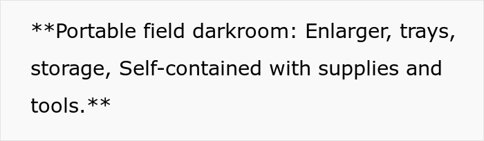 Portable field darkroom showing enlarger, trays, storage, and supplies arranged inside a self-contained setup for teens.