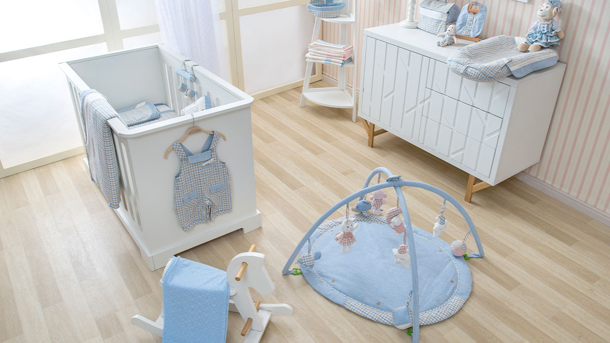 Baby nursery with crib and toys, representing lady encouraging disabled daughter to get pregnant and family feud topic.