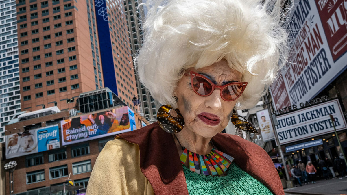 Eccentric street portrait of a person in colorful outfit and bold makeup, capturing unforgettable street photos artistry.