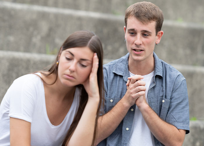 Young woman with cancer feeling resentful toward her healthy boyfriend due to past HPV infection discussing their relationship. Young woman with cancer feeling resentful toward her healthy boyfriend due to past HPV infection discussing their relationship.