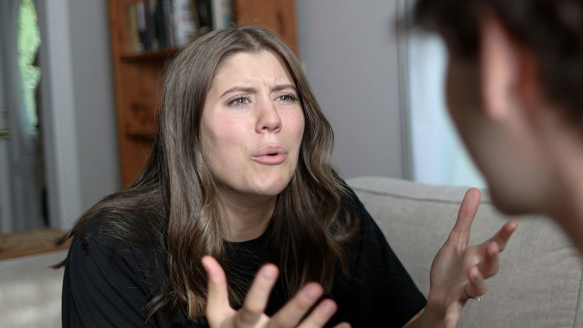 Postpartum lady arguing with sister-in-law while helping with triplets in a home setting.