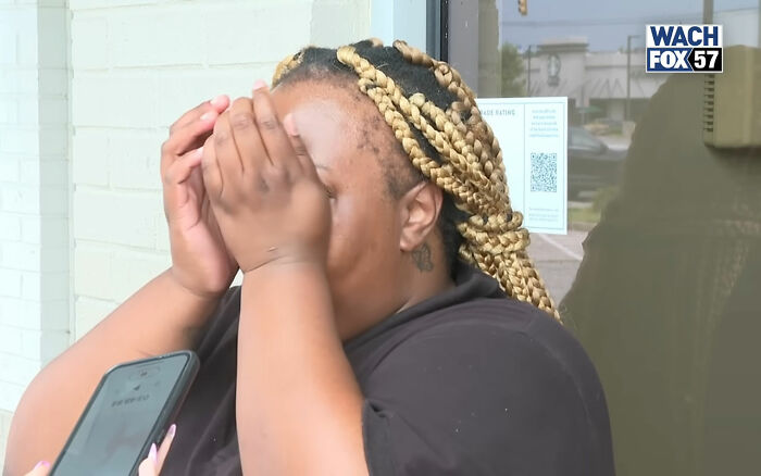 Burger King employee covering face during emotional update after viral 12-hour performance and firing. Burger King employee covering face during emotional update after viral 12-hour performance and firing.