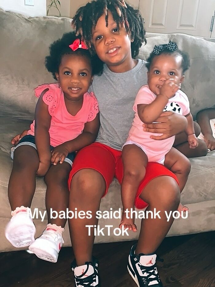 Three young children sitting on a couch, representing a Burger King employee’s emotional life update after viral performance. Three young children sitting on a couch, representing a Burger King employee’s emotional life update after viral performance.