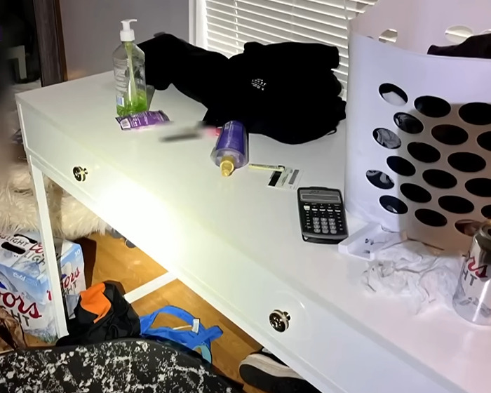 Jail room with scattered items on a white desk, highlighting a scene related to Bryan Kohberger with red hands. Jail room with scattered items on a white desk, highlighting a scene related to Bryan Kohberger with red hands.