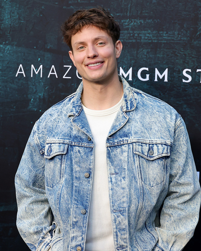 Matt Rife wearing a denim jacket and white shirt, smiling at an event with Amazon MGM Studios backdrop. Matt Rife wearing a denim jacket and white shirt, smiling at an event with Amazon MGM Studios backdrop.