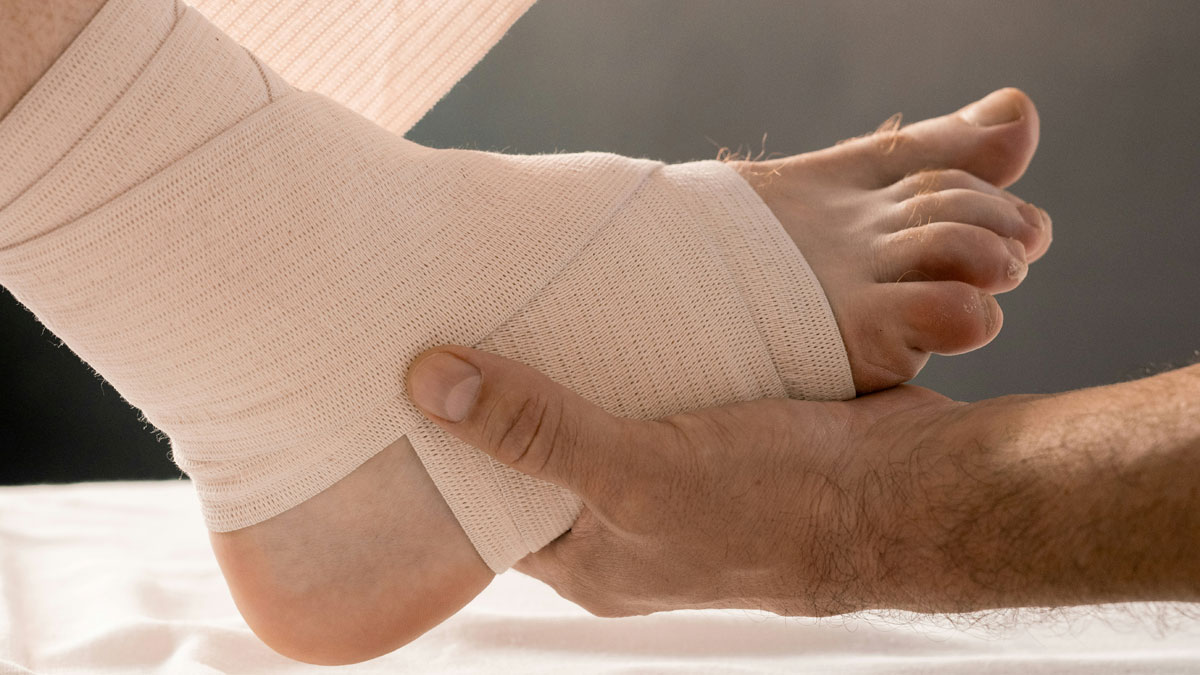 Close-up of a human foot wrapped in a medical bandage, highlighting cool facts about the human body and injury care.