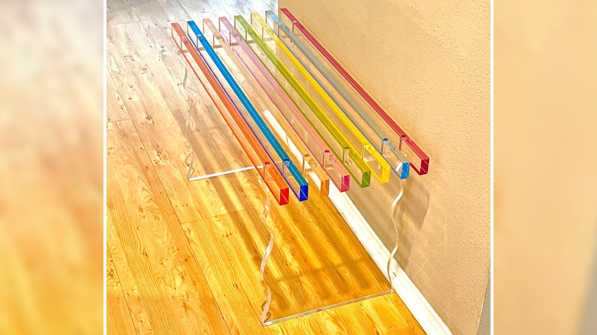 Colorful acrylic bench with transparent legs on wood floor showcasing peak coolness design and style.