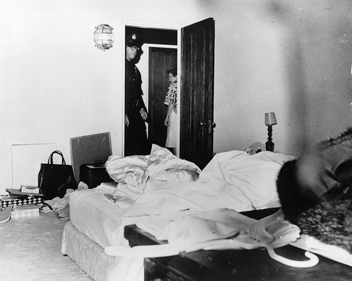 Police officer and woman entering a messy bedroom scene linked to Marilyn Monroe autopsy suspicious finding revealed decades later. Police officer and woman entering a messy bedroom scene linked to Marilyn Monroe autopsy suspicious finding revealed decades later.
