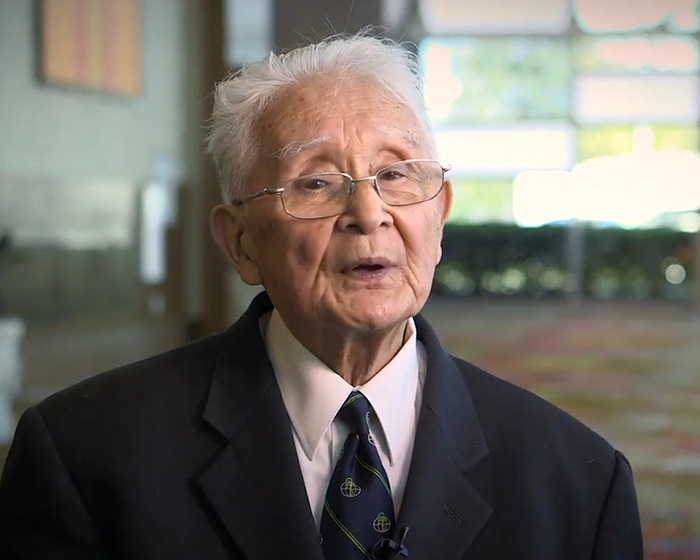 Elderly man in glasses and suit discussing Marilyn Monroe autopsy with suspicious findings decades later indoors. Elderly man in glasses and suit discussing Marilyn Monroe autopsy with suspicious findings decades later indoors.