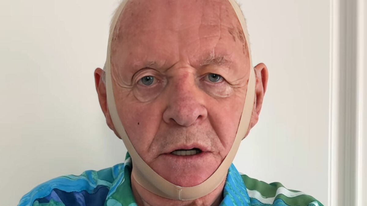Anthony Hopkins wearing a face slimming band, parodying viral beauty product in a humorous Hannibal Lecter style.