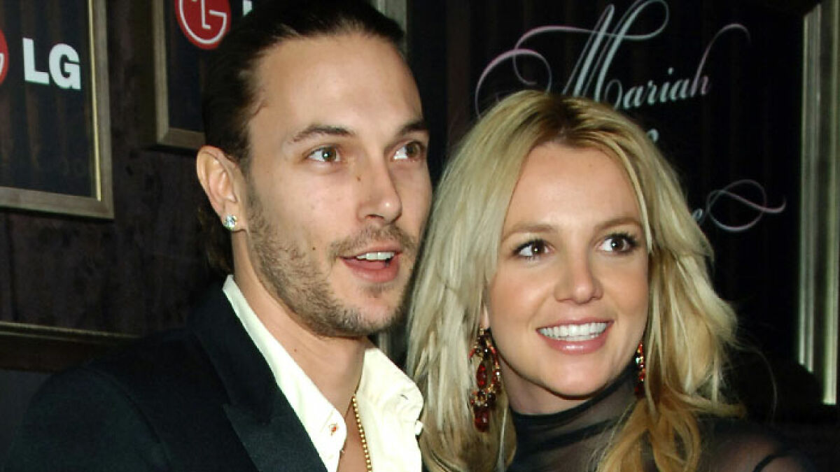 Kevin Federline and Britney Spears smiling at an event, highlighting Britney Spears fans' reaction to Kevin Federline memoir.