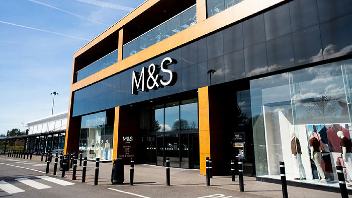 M&S store exterior with glass windows and mannequins, related to alleged trans employee controversy discussion.