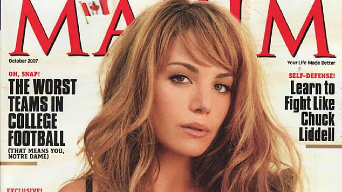 Magazine cover featuring a woman with long wavy hair, related to Maxim faces backlash and unattractive women list topic.