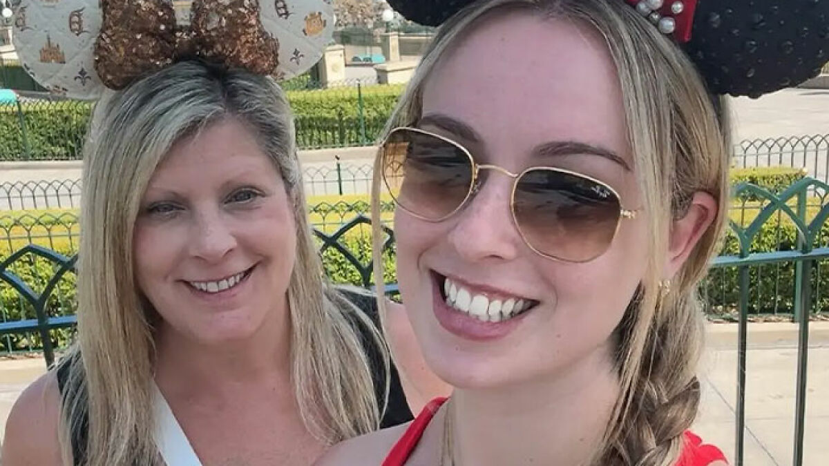 Two women wearing Disney World mouse ears smiling outdoors in a shocking twist violent incident at Disney World
