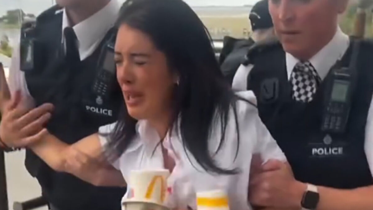 Police officers detaining a distressed woman in a McDonald's while new details emerge after 13-year-old arrest video causes outrage.