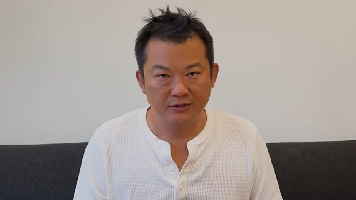 Prominent chef in a white shirt addressing the viral influencer scandal affecting career and family on camera.