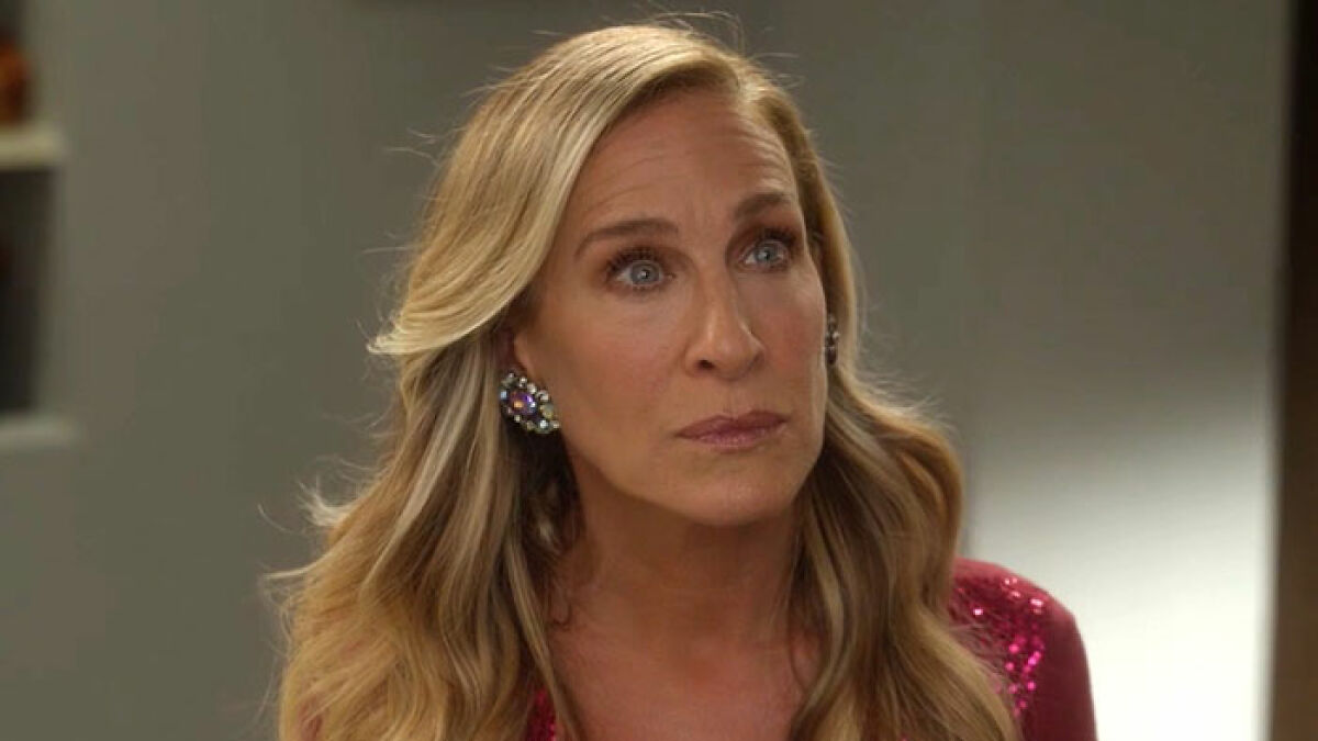 Sarah Jessica Parker reacting thoughtfully in a scene from And Just Like That series finale addressing haters.