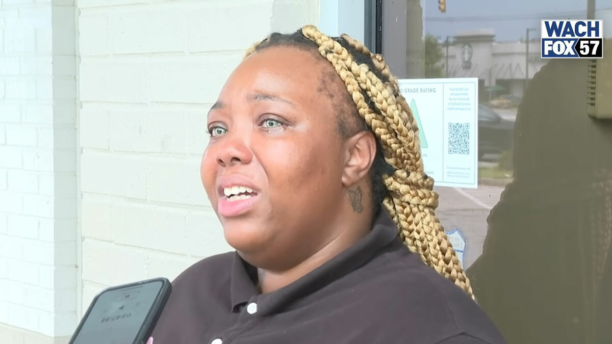 Burger King employee with braided hair speaks emotionally during interview after viral 12-hour work performance and firing.