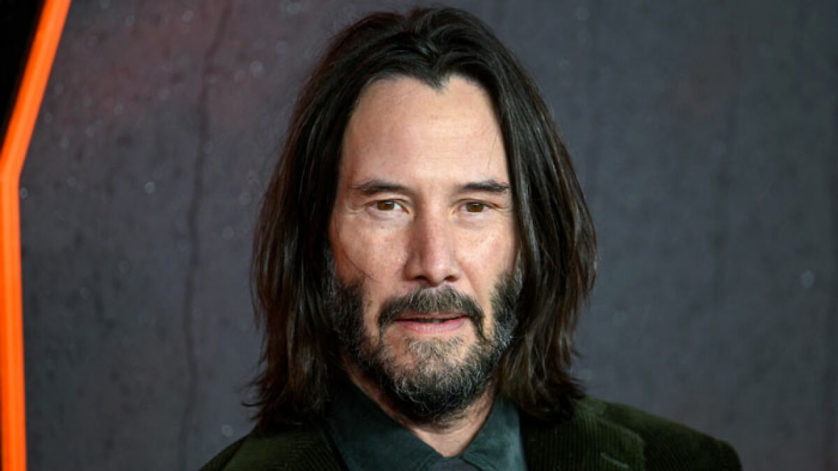Keanu Reeves with long hair and beard edited by AI to resemble Jack Sparrow, sparking reactions from Johnny Depp fans.
