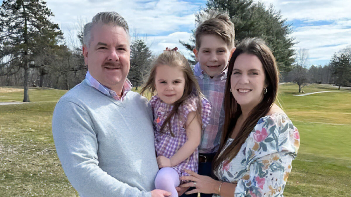 Family of four outdoors, showing a mother and children, relating to depressed mom and perfect family SEO keywords.