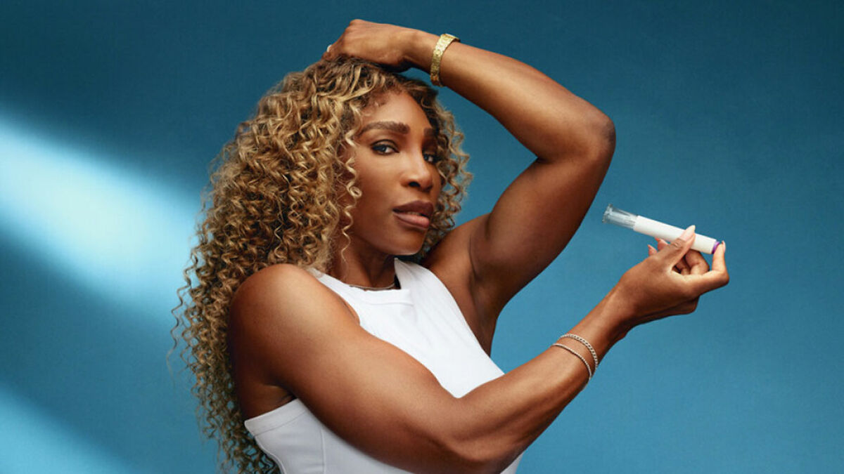 Serena Williams holding a weight loss jab, showcasing her toned arms against a blue background in a white sleeveless top