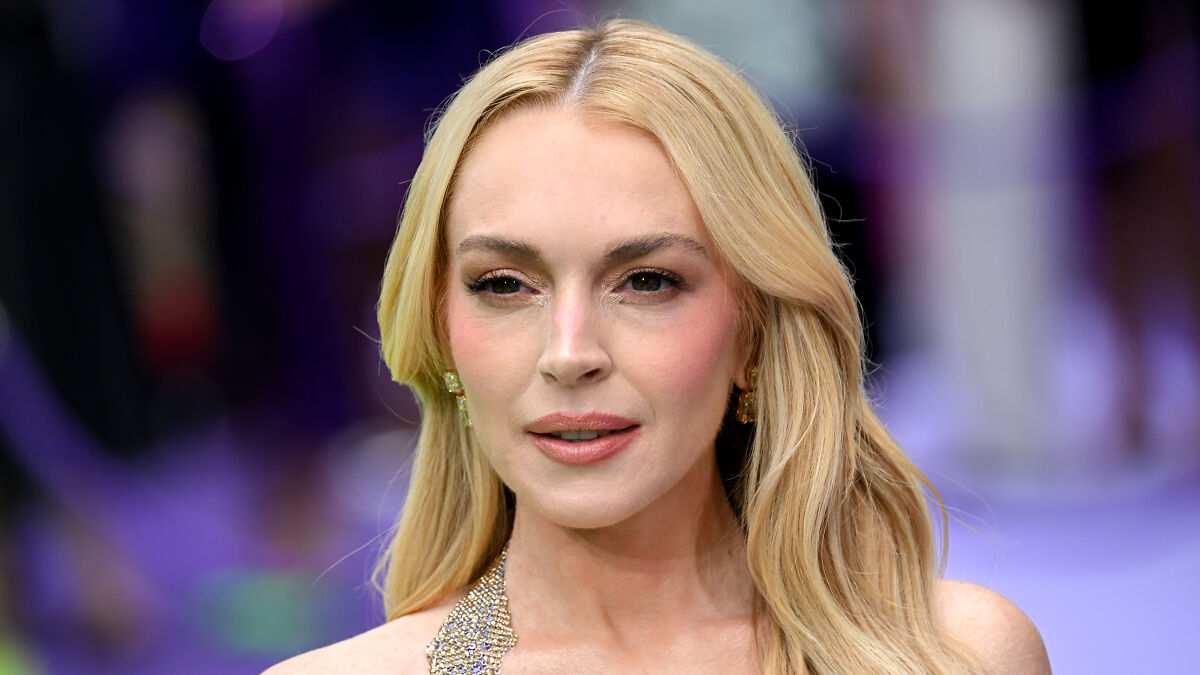 Lindsay Lohan without makeup, stunning fans after responding to plastic surgery rumors in a close-up portrait.