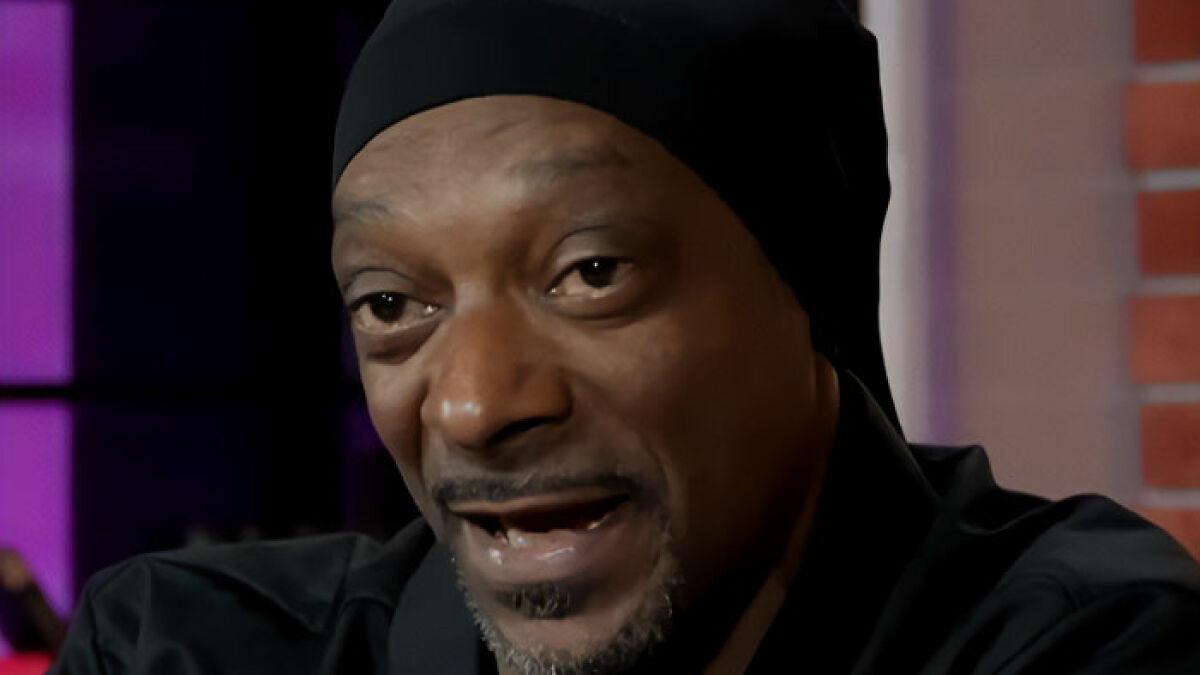 Snoop Dogg speaking in an interview, reacting to LGBTQ+ representation in kids films, sparking public outrage.