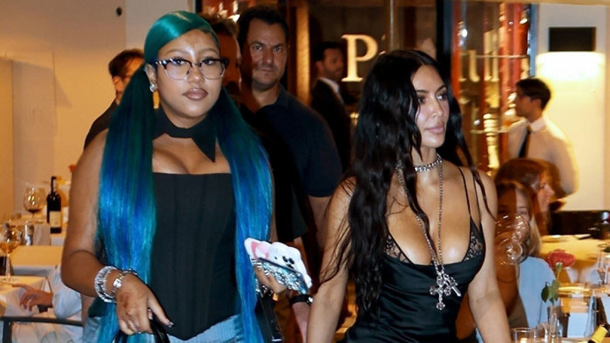 Kim Kardashian seen wearing a revealing black corset dress amid controversy over daughter North Westu2019s corset fashion.