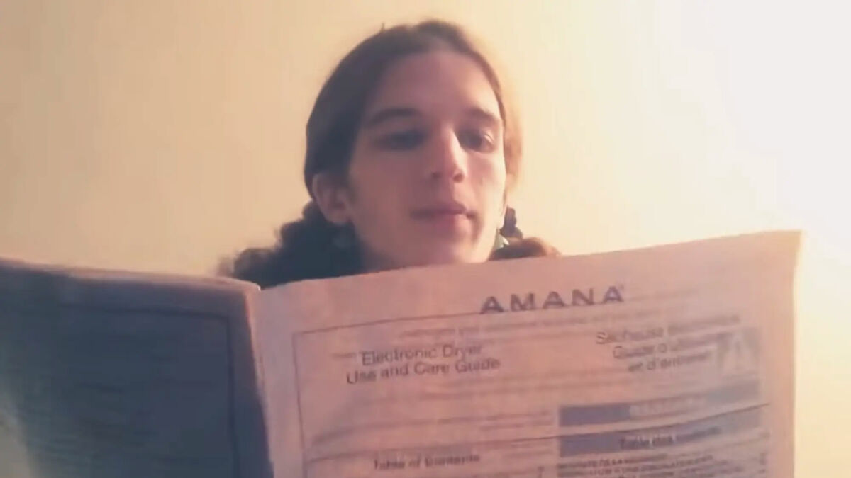 Young person holding a document in a video linked to Minneapolis Catholic school suspect and chilling manifesto.