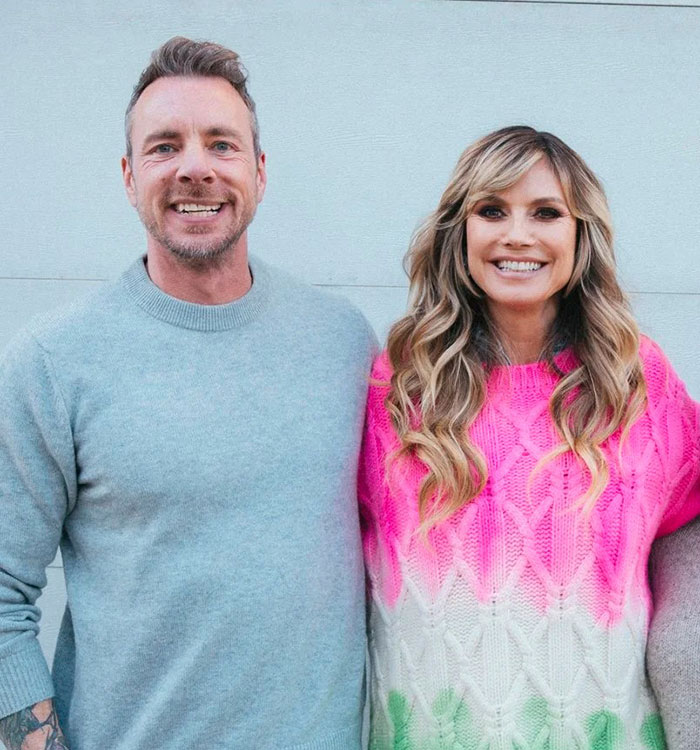 Dax Shepard and Heidi Klum smiling together, with Dax Shepard enjoying a photo of Heidi Klum. Dax Shepard and Heidi Klum smiling together, with Dax Shepard enjoying a photo of Heidi Klum.