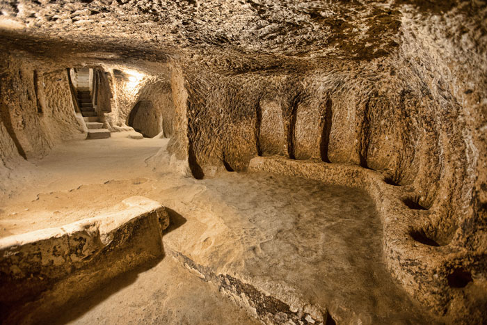 Ancient mysterious underground city interior with carved walls and narrow passageways, 18 stories and 280 feet deep. Ancient mysterious underground city interior with carved walls and narrow passageways, 18 stories and 280 feet deep.