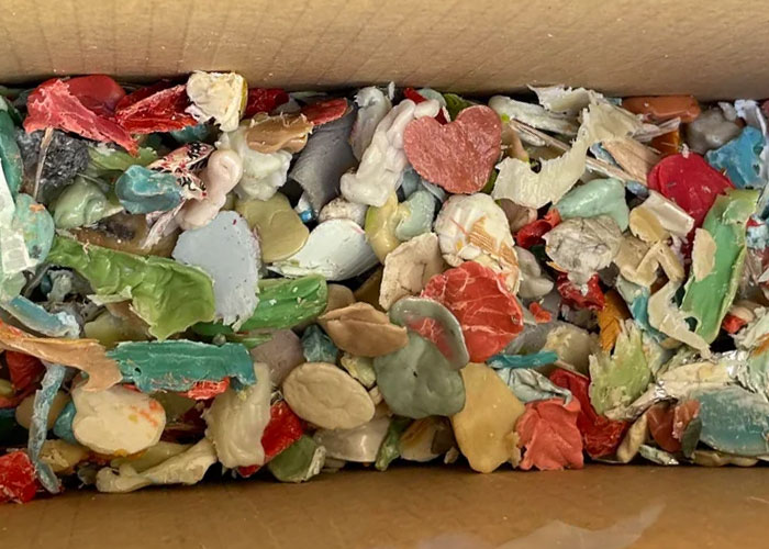 Close-up of a box filled with shattered colorful pieces, illustrating disgusting things people discovered about their friends.