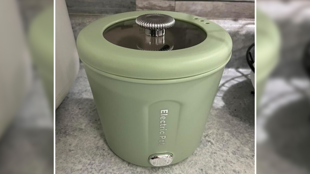 Compact green electric pot on countertop, ideal dorm kitchen essential for quick and easy cooking.